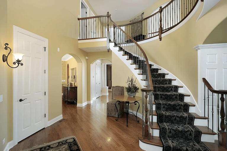 How Do Designers Create Beautiful Rooms Around Staircases?